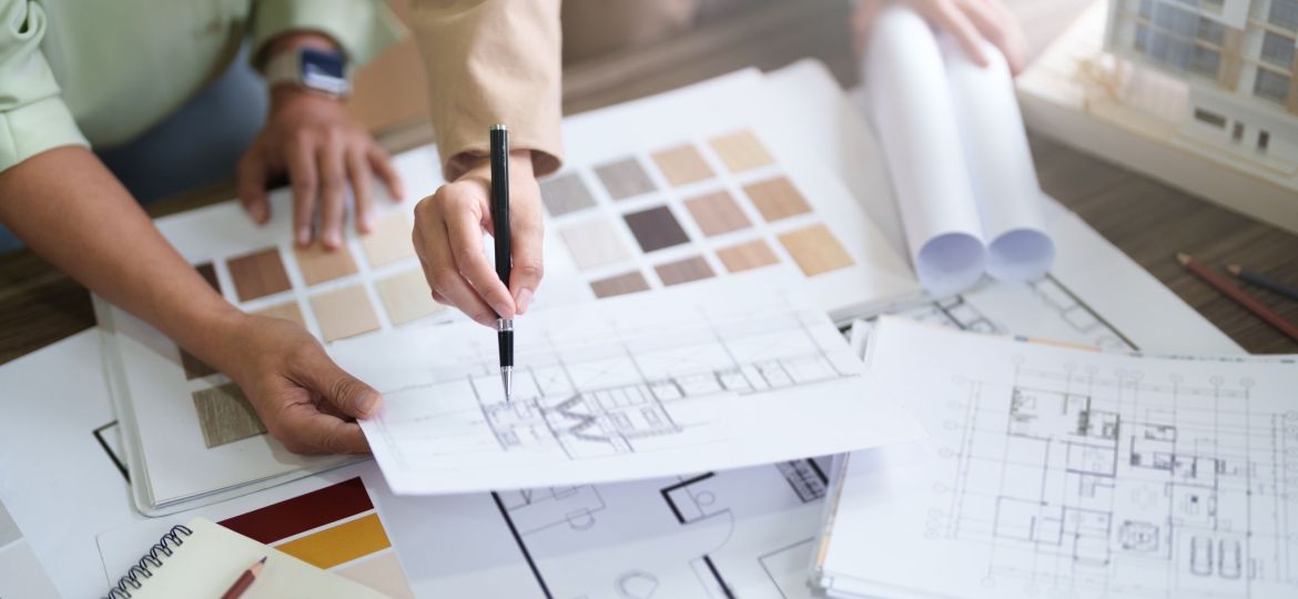 Interior architect working with blueprint planning in modern office, engineering concept.