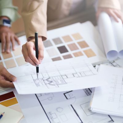 Interior architect working with blueprint planning in modern office, engineering concept.